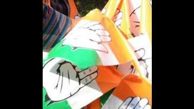 Congress party workers preparing the party symbol flags for campaigning in the assembly elections in Shimla. (HT File)
