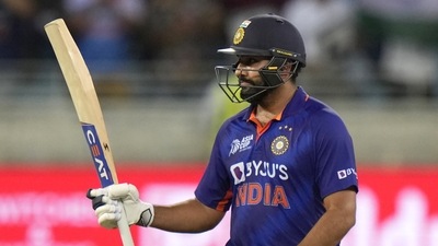 India's captain Rohit Sharma raises his bat to celebrate scoring fifty runs during the T20 cricket match (AP) India's captain Rohit Sharma raises his bat to celebrate scoring fifty runs during the T20 cricket match (AP)