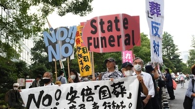 Shinzo Abe's State Funeral: Demonstrators hold placards during a protest against the planned state funeral for former Prime Minister Shinzo Abe in Tokyo, Japan. (Bloomberg)