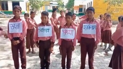 The image, taken from the Twitter video, shows the kids singing a song while learning about Hindi grammar. (Twitter/@arpit_verma13)