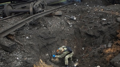 Russia-Ukraine War: A sapper inspects a crater left by a Russian missile strike. (Reuters)