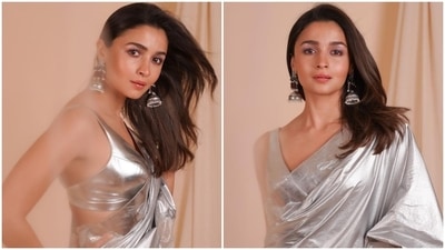 Navratri days are incomplete without a saree look and day 6 is the perfect opportunity to drees up in gorgeous sarees. The colour of the day is grey and it can be best celebrated by opting for a silver dazzling saree like Alia Bhatt. The silver saree with a sleeveless blouse featuring a plunging V neckline and backless detailing is just perfect to look all glam in Navratri. (Instagram/@AliaBhatt) Navratri days are incomplete without a saree look and day 6 is the perfect opportunity to drees up in gorgeous sarees. The colour of the day is grey and it can be best celebrated by opting for a silver dazzling saree like Alia Bhatt. The silver saree with a sleeveless blouse featuring a plunging V neckline and backless detailing is just perfect to look all glam in Navratri. (Instagram/@AliaBhatt)