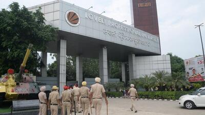 Police personnel keep vigil outside Lovely Professional University, after protests erupted on Tuesday night following the death of a student by suicide, in Jalandhar on Wednesday. (PTI) Police personnel keep vigil outside Lovely Professional University, after protests erupted on Tuesday night following the death of a student by suicide, in Jalandhar on Wednesday. (PTI)