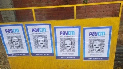 ‘PayCM’ photos with Karnataka chief minister Basavaraj Bommai's likeness were seen in Bengaluru on Wednesday (Credit: Twitter/@DebasisSahoo31) ‘PayCM’ photos with Karnataka chief minister Basavaraj Bommai's likeness were seen in Bengaluru on Wednesday (Credit: Twitter/@DebasisSahoo31)