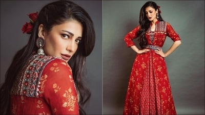 The second day of Navratri is all about red. If you are bored of traditional lehengas and gowns and then Shruti Haasan's red lehenga is a perfect outfit inspiration for you. Printed red lehenga with organza cape looks modern, chic as well as super stylish. You'll have a distinctive appearance with this look and will be the centre of attention. (Instagram/shrutzhaasan) The second day of Navratri is all about red. If you are bored of traditional lehengas and gowns and then Shruti Haasan's red lehenga is a perfect outfit inspiration for you. Printed red lehenga with organza cape looks modern, chic as well as super stylish. You'll have a distinctive appearance with this look and will be the centre of attention. (Instagram/shrutzhaasan)