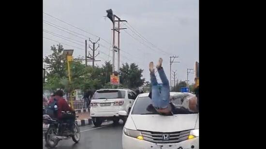 The video purportedly shows several students fleeing even as a speeding Honda City car comes at them head on. The car hits one of the students and he was thrown several feet into the air before collapsing on the road. (Video grab/HT Photo)