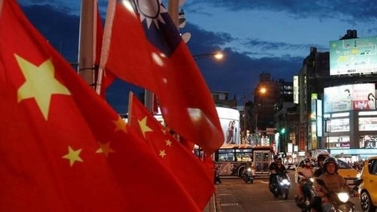 China-Taiwan Conflict: Flags of China and Taiwan flutter next to each other during a rally in Taipei, Taiwan.(Reuters)