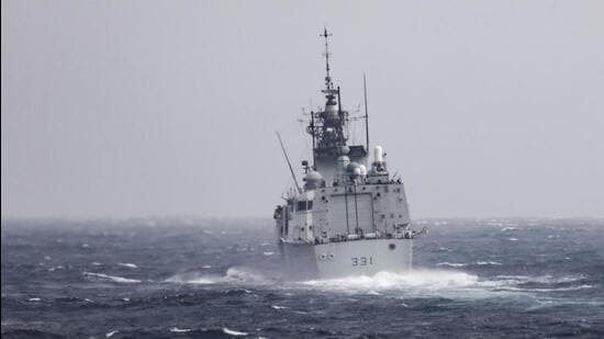 In this photo provided by US Navy, The Royal Canadian Navy Halifax-class frigate HMCS Vancouver (FFH 331) transits the Taiwan Strait with guided-missile destroyer USS Higgins (DDG 76) while conducting a routine transit on Tuesday. (AP)