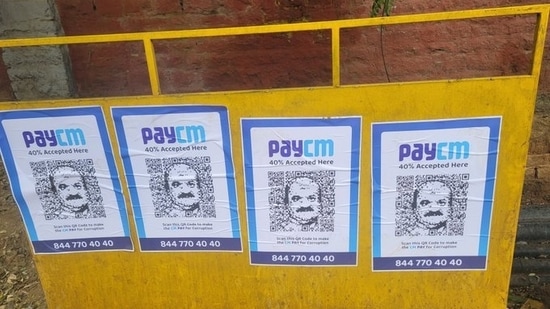 ‘PayCM’ photos with Karnataka chief minister Basavaraj Bommai's likeness were seen in Bengaluru on Wednesday (Credit: Twitter/@DebasisSahoo31)