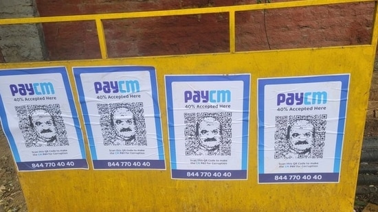 ‘PayCM’ photos with Karnataka chief minister Basavaraj Bommai's likeness were seen in Bengaluru on Wednesday (Credit: Twitter/@DebasisSahoo31)