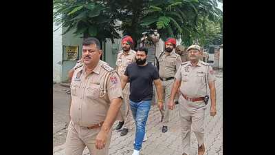 Gangster Goru Bachha in Khanna police custody on Thursday. (HT Photo) Gangster Goru Bachha in Khanna police custody on Thursday. (HT Photo)