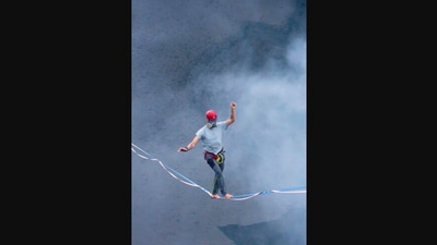 The image, taken from the Instagram video, shows one of the adventure lovers completing a slackline walk over an active volcano. (Instagram/@guinnessworldrecords)