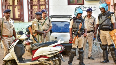 Police personnel during a raid of National Investigation Agency (NIA) at the residence of a functionary of Popular Front of India (PFI), in Madurai. (PTI)