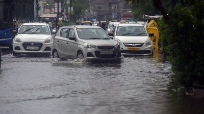 Commuters wade through a waterlogged stretch near Civic Centre, in New Delhi, India, on Thursday. (HT Photo/Raj K Raj) Commuters wade through a waterlogged stretch near Civic Centre, in New Delhi, India, on Thursday. (HT Photo/Raj K Raj)