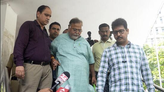 Former West Bengal minister Partha Chatterjee being produced in Alipore court . (ANI)