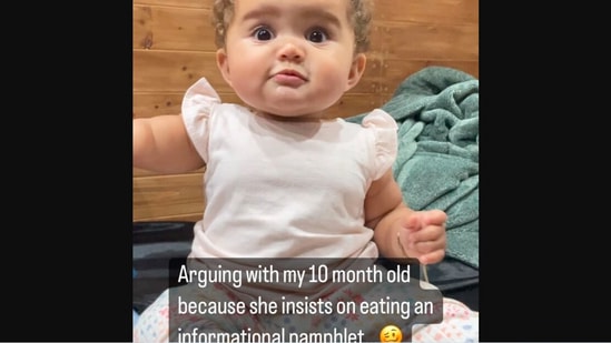 The image, taken from the Instagram video, shows the kid ‘arguing’ with her mom after she stopped her from eating paper.(Instagram/@projectparenthood_)