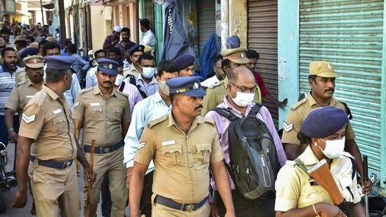 National Investigation Agency (NIA) and police personnel during a raid in Madurai. (PTI) National Investigation Agency (NIA) and police personnel during a raid in Madurai. (PTI)