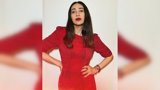 Karisma Kapoor opted for a textured red dress featuring elbow-length sleeves for her sister Kareena Kapoor Khan's birthday bash.(Instagram/@therealkarismakapoor)