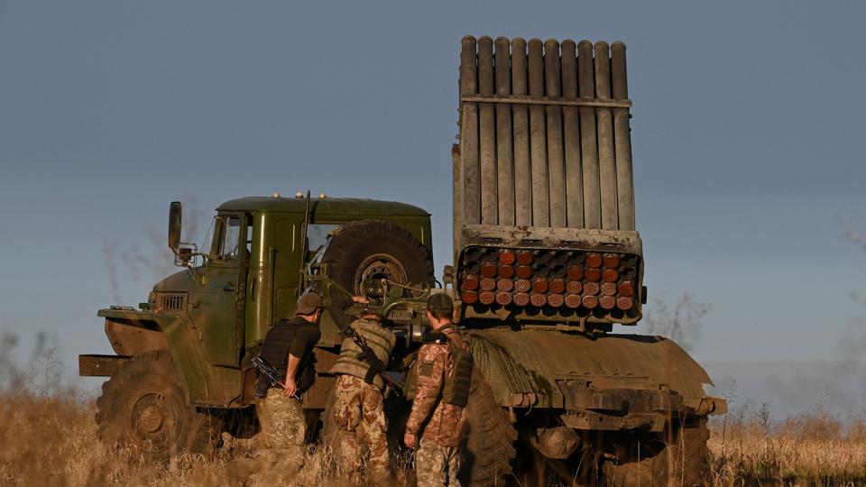 Ukrainian soldiers stand next to a BM-21 'Grad' multiple rocket launcher in eastern Ukraine on Thursday. (AFP) Ukrainian soldiers stand next to a BM-21 'Grad' multiple rocket launcher in eastern Ukraine on Thursday. (AFP)