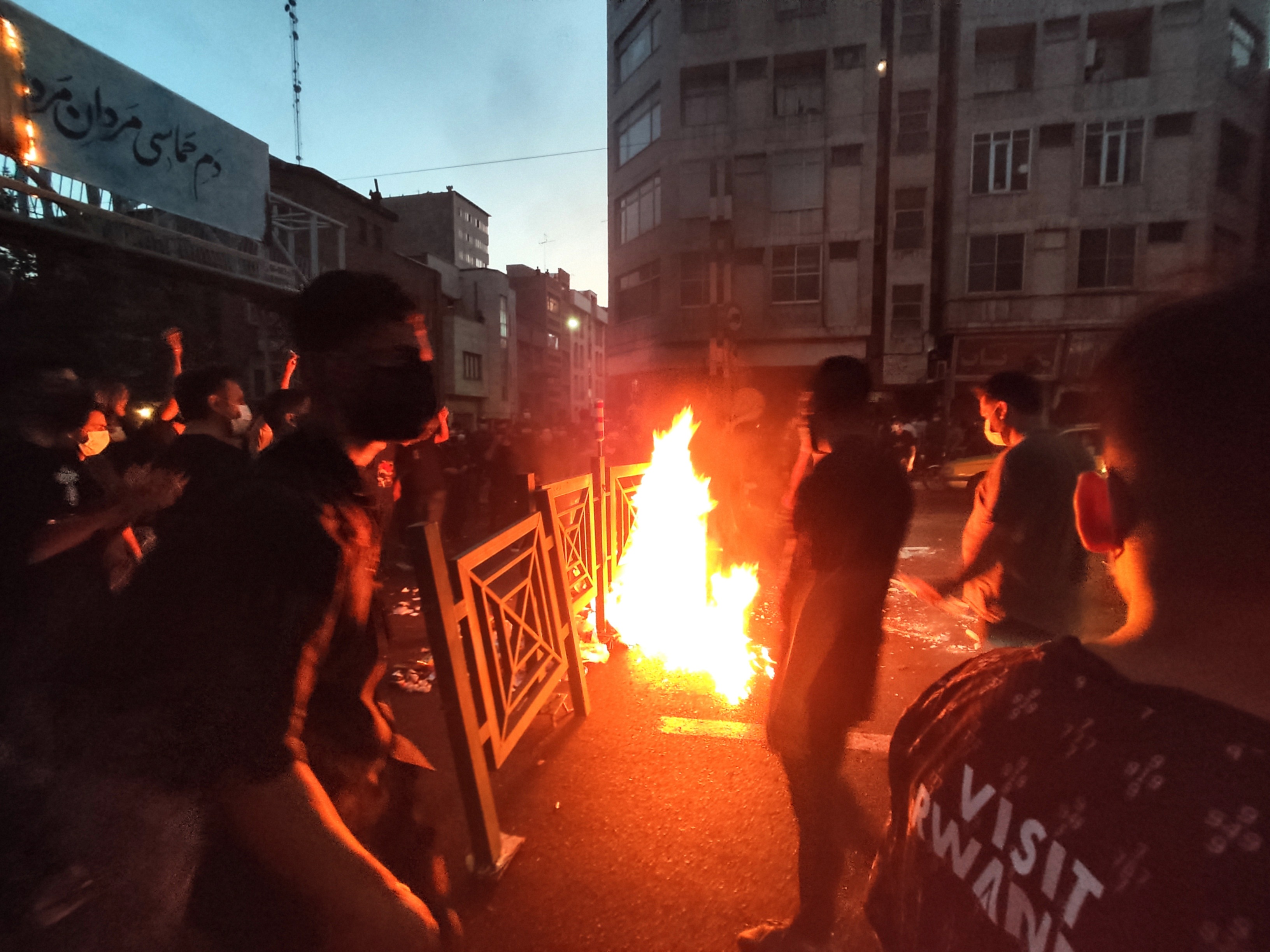 Iran Hijab Protests: Protesters make fire and block the street during a protest in Tehran. (AP)