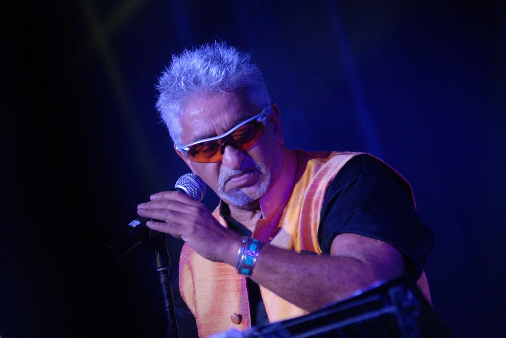 Joe Alvarez performing on stage