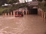A flooded underpass on the Greater Noida Expressway following heavy rains on Friday, (PTI) A flooded underpass on the Greater Noida Expressway following heavy rains on Friday, (PTI)