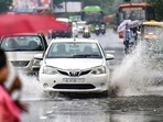 Vehicles drive though a waterlogged road in Delhi. (PTI photo) Vehicles drive though a waterlogged road in Delhi. (PTI photo)