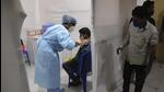 A health worker administers the vaccine for COVID-19 in Mumbai, India, Thursday, Aug. 19, 2021. (AP Photo/Rafiq Maqbool) (AP) A health worker administers the vaccine for COVID-19 in Mumbai, India, Thursday, Aug. 19, 2021. (AP Photo/Rafiq Maqbool) (AP)
