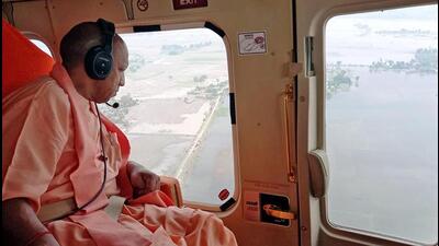 UP chief minister Yogi Adityanath conducts an aerial survey of the flood-affected districts on Friday. (ANI Photo)