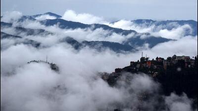 Clouds hang low over the hills following heavy rainfall near Shimla on Thursday. Widespread rain is forecast in Himachal Pradesh till September 25. (Deepak Sansta/HT)