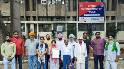 Members of labour unions coming out of office of Ludhiana CP after filing a complaint . (HT PHOTO)