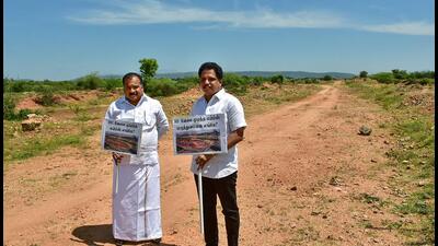 Congress MP Manickam Tagore and CPI(M) MP S. Venkatesan at the site earmarked for the construction of AIIMS Madurai on Friday. (PTI) Congress MP Manickam Tagore and CPI(M) MP S. Venkatesan at the site earmarked for the construction of AIIMS Madurai on Friday. (PTI)