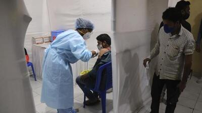 A health worker administers the vaccine for COVID-19 in Mumbai, India, Thursday, Aug. 19, 2021. (AP Photo/Rafiq Maqbool) (AP) A health worker administers the vaccine for COVID-19 in Mumbai, India, Thursday, Aug. 19, 2021. (AP Photo/Rafiq Maqbool) (AP)
