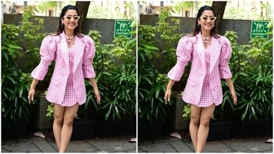 Rashmika wore her tresses into a messy knot and left her tresses open in straight locks as she smiled with all her hearts for the cameras. (HT Photos/Varinder Chawla) Rashmika wore her tresses into a messy knot and left her tresses open in straight locks as she smiled with all her hearts for the cameras. (HT Photos/Varinder Chawla)