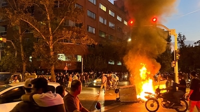 Iran Anti-Hijab Protests: A police motorcycle burns during a protest over the death of Mahsa Amini. (Reuters)