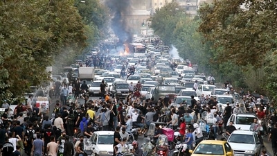 Iran Anti-Hijab Protests: Protesters chant slogans during a protest over the death of a woman who was detained by the morality police. (AP)