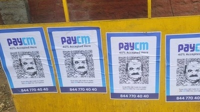 ‘PayCM’ photos with Karnataka chief minister Basavaraj Bommai's likeness were seen in Bengaluru on Wednesday (Credit: Twitter/@DebasisSahoo31) ‘PayCM’ photos with Karnataka chief minister Basavaraj Bommai's likeness were seen in Bengaluru on Wednesday (Credit: Twitter/@DebasisSahoo31)