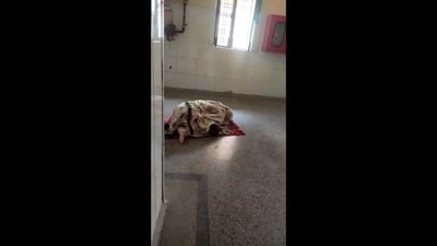 The video of patient's attendant offering namaz outside a ward at a government hospital in Prayagraj is being widely shared on social media. (Source: Twitter) The video of patient's attendant offering namaz outside a ward at a government hospital in Prayagraj is being widely shared on social media. (Source: Twitter)