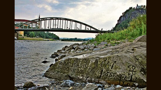 Hunger stones, engraved as famine memorials, emerge as river levels drop. (Norbert Kaiser via Wikimedia Commons)
