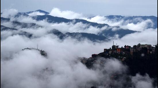 Clouds hang low over the hills following heavy rainfall near Shimla on Thursday. Widespread rain is forecast in Himachal Pradesh till September 25. (Deepak Sansta/HT)