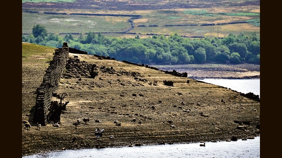 The Thruscross reservoir, dried out in the heat wave, has revealed remnants of a 17th-century village that was submerged in the 1960s. (Getty Images)