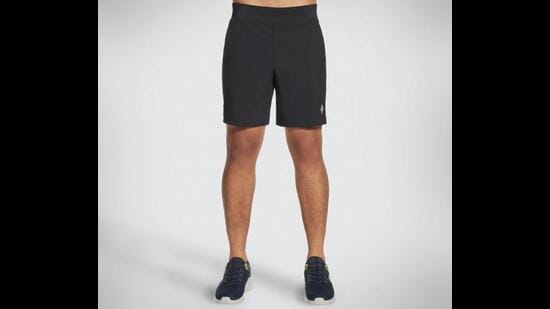 Wear tapered, stretchable and long, but sexy running shorts for sports and more (Go Walk moisture wicking black shorts by Skechers)