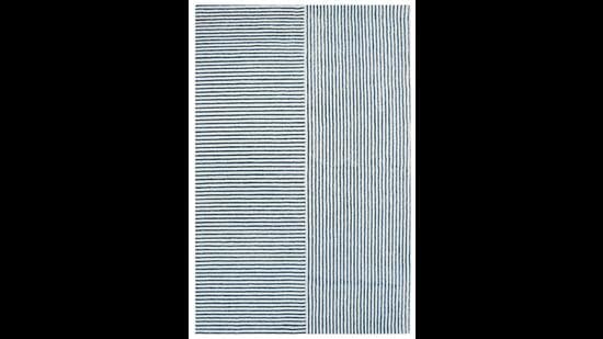 This stunning multi patterned striped rug will lend a masculine, nautical look to any room. (The Eucalyptus hand tufted wool rug by Rugberry) This stunning multi patterned striped rug will lend a masculine, nautical look to any room. (The Eucalyptus hand tufted wool rug by Rugberry)