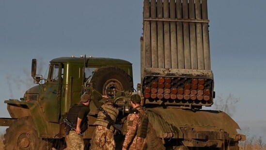 Ukrainian soldiers stand next to a BM-21 'Grad' multiple rocket launcher in eastern Ukraine on Thursday. (AFP)