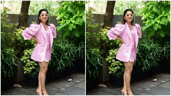 In tinted shades with vintage vibes and transparent stilettos, Rashmika perfectly accessorised her look for the day.(HT Photos/Varinder Chawla)