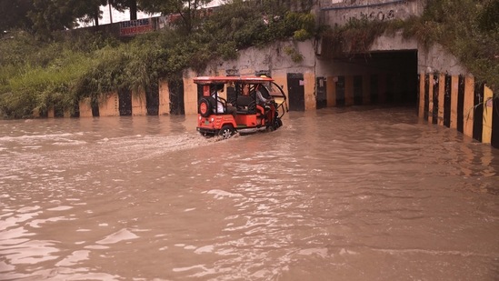 A flooded underpass on the Greater Noida Expressway following heavy rains on Friday, (PTI) A flooded underpass on the Greater Noida Expressway following heavy rains on Friday, (PTI)