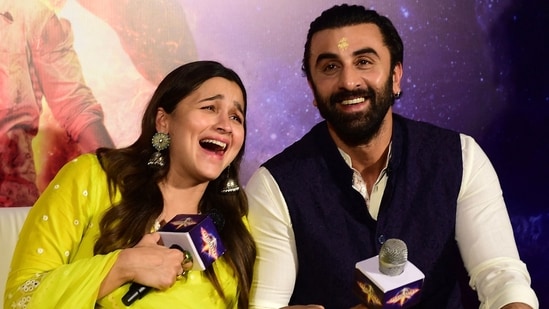 Alia Bhatt (L) and Ranbir Kapoor gesture during the promotion of their Hindi film Brahmastra.(AFP)