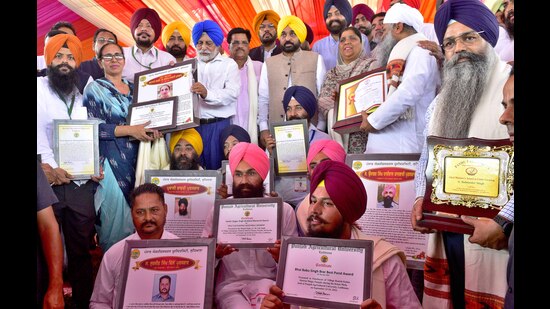 Ludhiana, India – September 23, 2022 : Chief Minister Bhagwant Mann, Cabinet Minister Kuldeep Singh Dhaliwal, Vice Chancellor Dr. Satbir Singh Gosal honoring progressive farmers after inauguration of Kisan Mela at PAU and later Pashu Palan Mela at GADVASU in Ludhiana on Friday, September 23, 2022. (Photo by Gurpreet Singh/Hindustan Times)