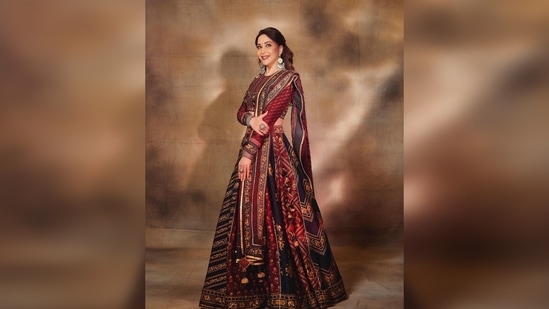 Madhuri Dixit's lehenga is made of heavy raw silk and features two shades - red and black. Sharing her photos on her Instagram handle, she captioned her post, “Maja Ma!."(Instagram/@madhuridixitnene)