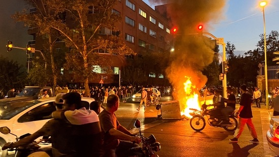 FILE PHOTO: A police motorcycle burns during a protest over the death of Mahsa Amini, a woman who died after being arrested by the Islamic republic's "morality police", in Tehran, Iran.(REUTERS)